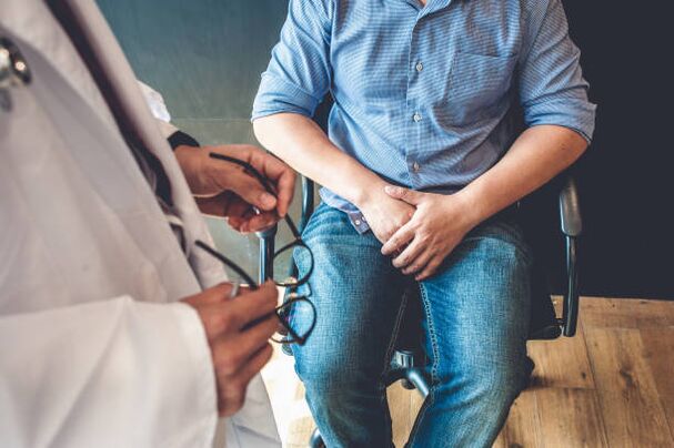 a man with symptoms of prostatitis during a doctor's appointment